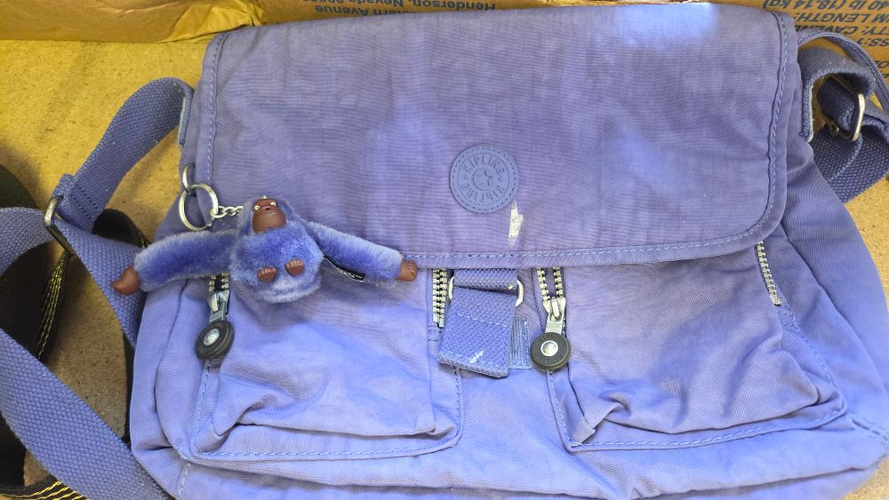 Lot 192 – A Kipling Purple Nylon Messenger Crossbody Bag with Keychain