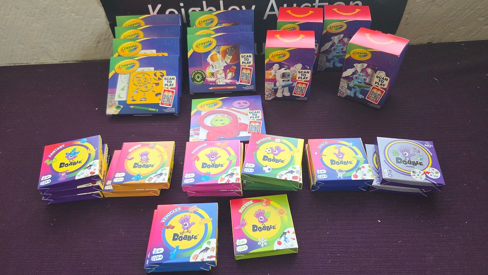Lot 183 – A Collection of McDonald’s Crayola Promotional Activity Sets and Asmodee Dobble Themed Card Games