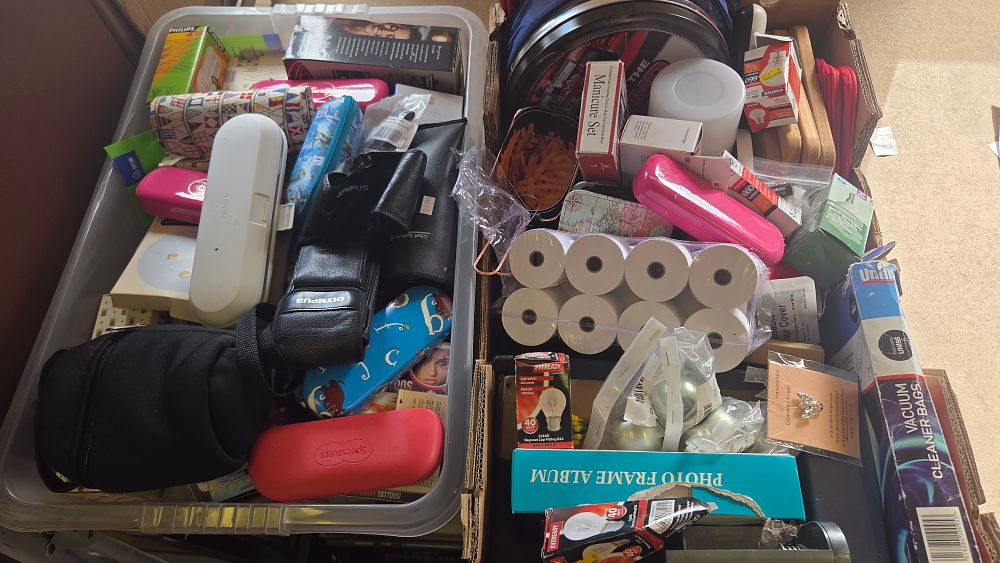Lot 201 – Two Boxes of Mixed Household Consumer Goods Including Lighting Stationery and Personal Care Items