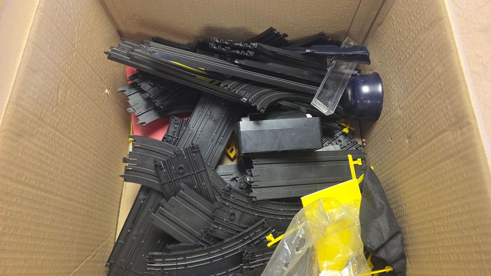 Lot 311 – A Collection of HO Scale Electric Slot Car Track and Accessories