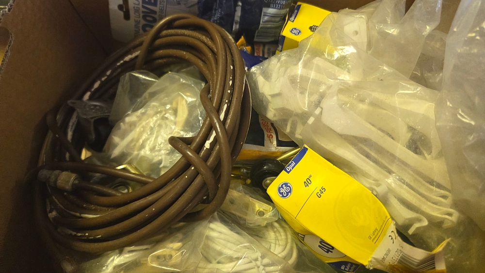 Lot 322 – An Assortment of Electrical and Hardware Supplies including Extension Cords and Light Bulbs