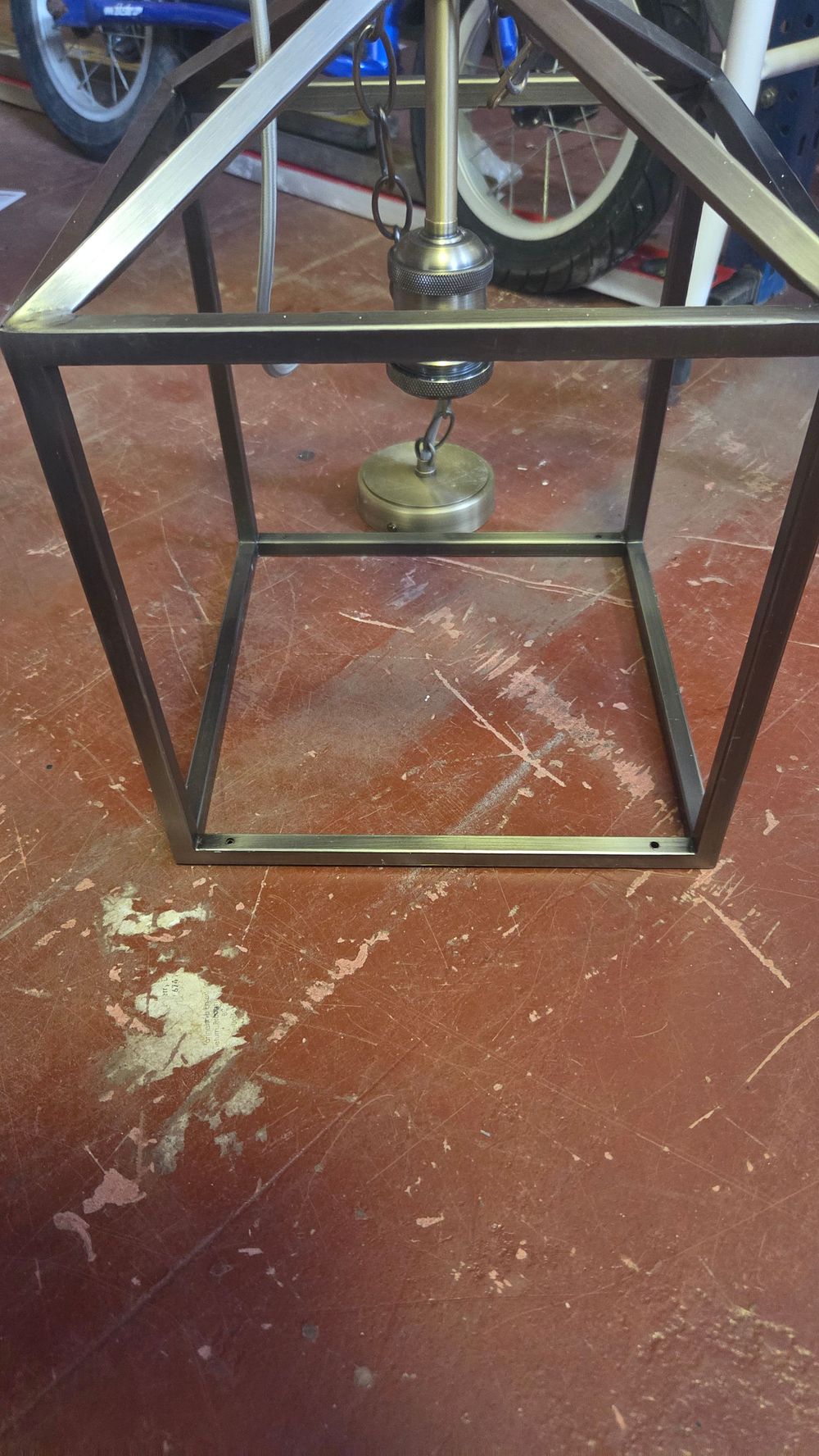 Lot 361 – A contemporary industrial-style open-frame metal pendant light fixture