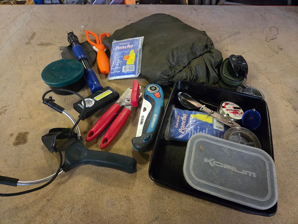 Lot 375 – An Assortment of Outdoor Survival Tools and Fishing Tackle