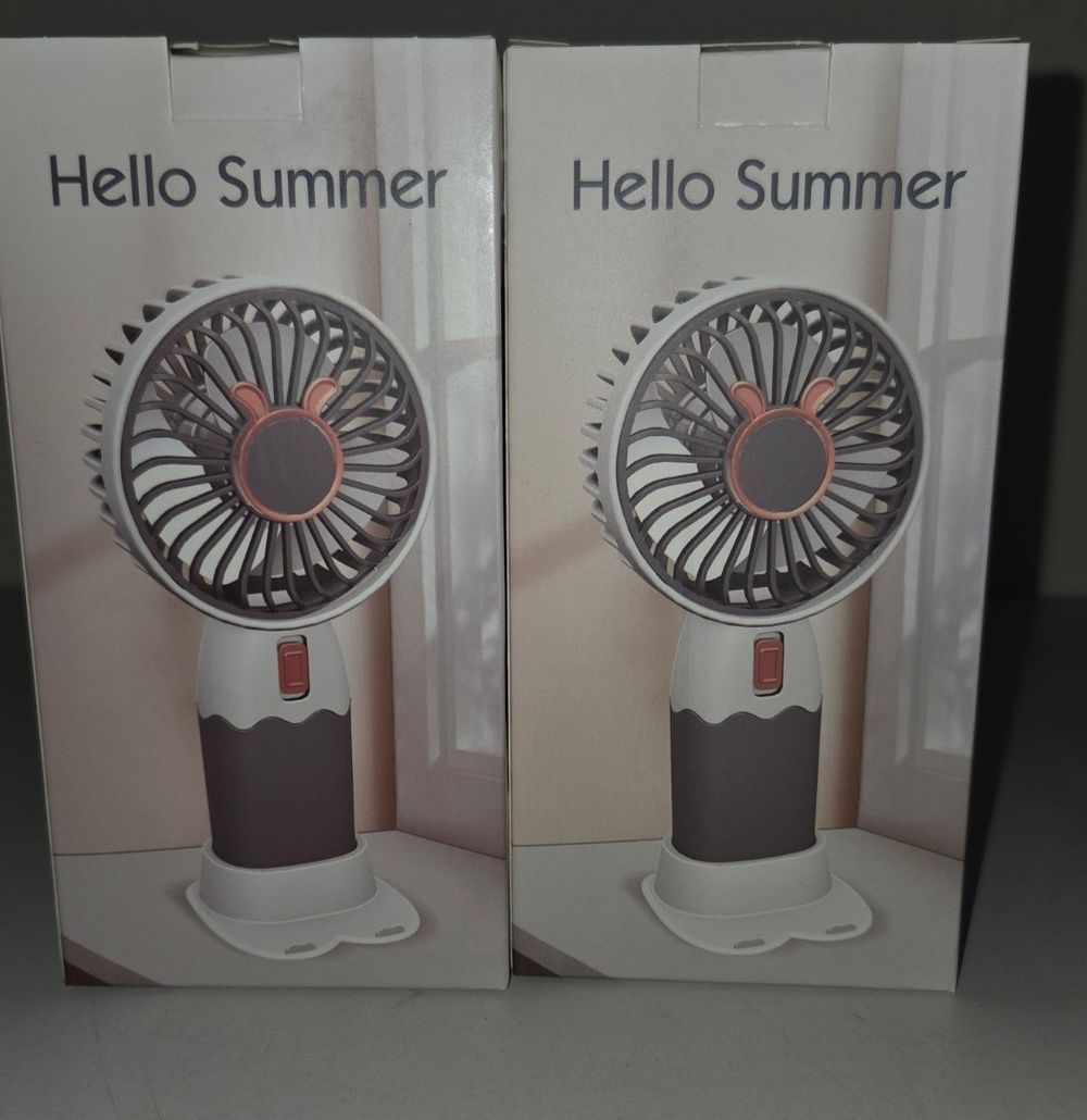 Lot 384 – A Pair of Portable Handheld Mini Fans with Hello Summer Packaging