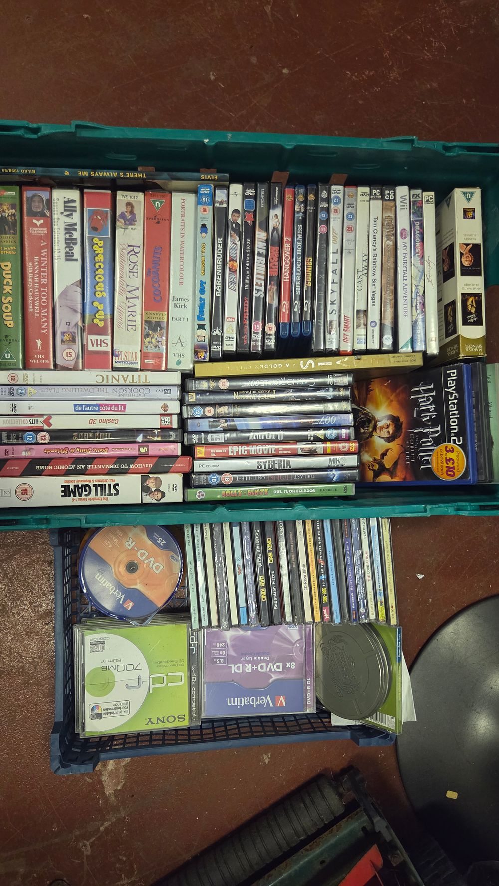 Lot 159 – A Collection of Assorted Home Entertainment Media including DVDs, Video Games, and VHS Tapes