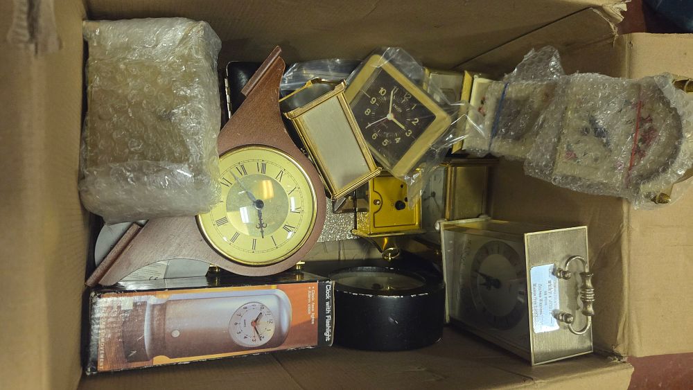 Lot 214 – A Collection of Approximately Ten Mantel, Carriage, and Travel Clocks