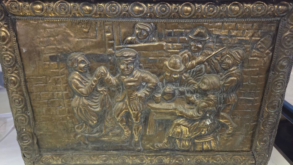 Lot 257 – A late 19th or early 20th-century embossed brass-clad wooden fireside box