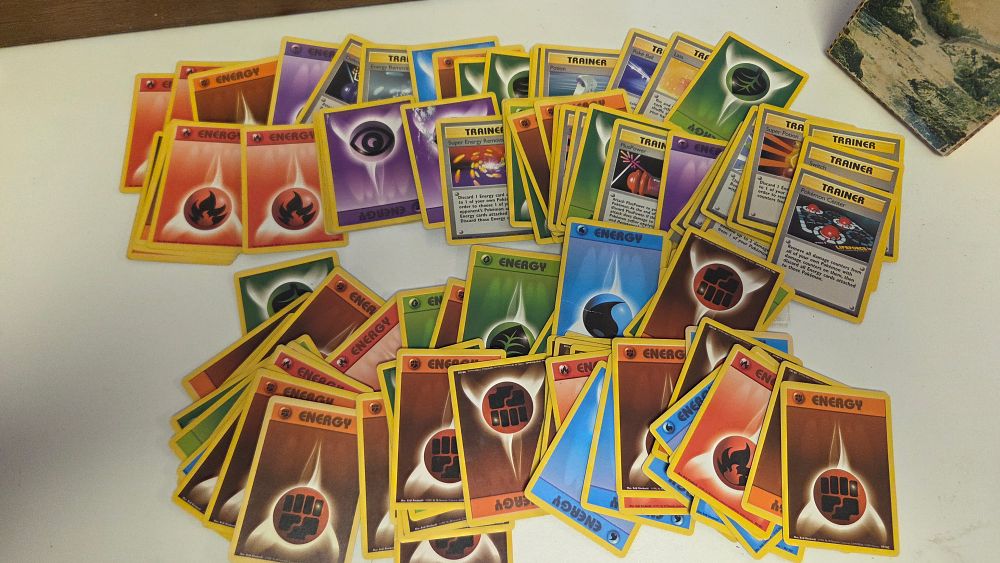 Lot 293 – An Assortment of Vintage Pokemon TCG Shadowless and Unlimited Energy and Trainer Cards