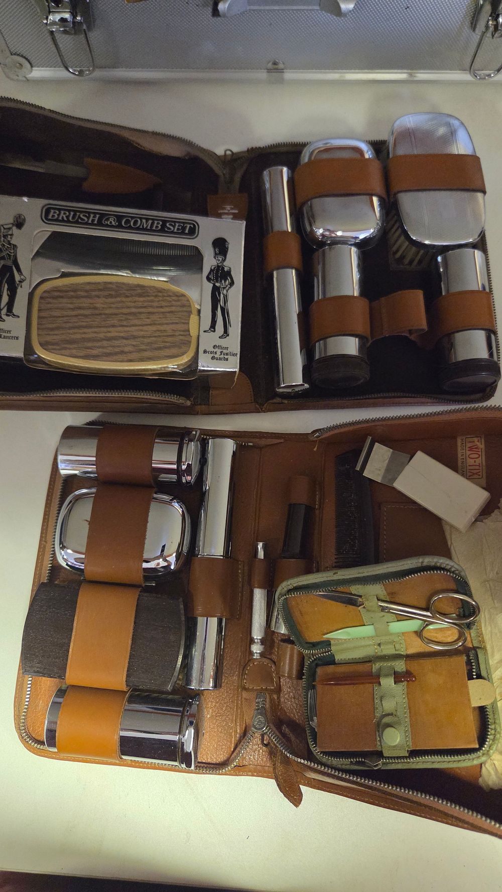 Lot 295 – Selection of Vintage Leather Travel Grooming Sets including a Two-Tix British-made Vanity Kit with Writing Instruments