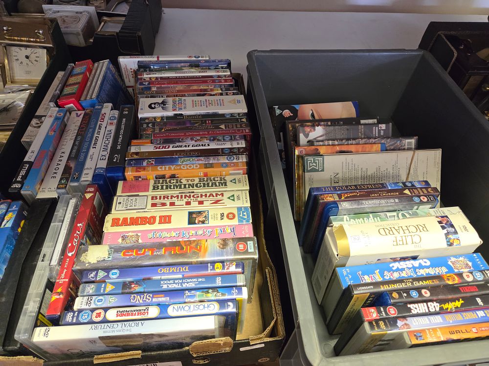 Lot 314 – A Collection of Assorted DVD and VHS Home Media including Film, Documentary, and Music Titles