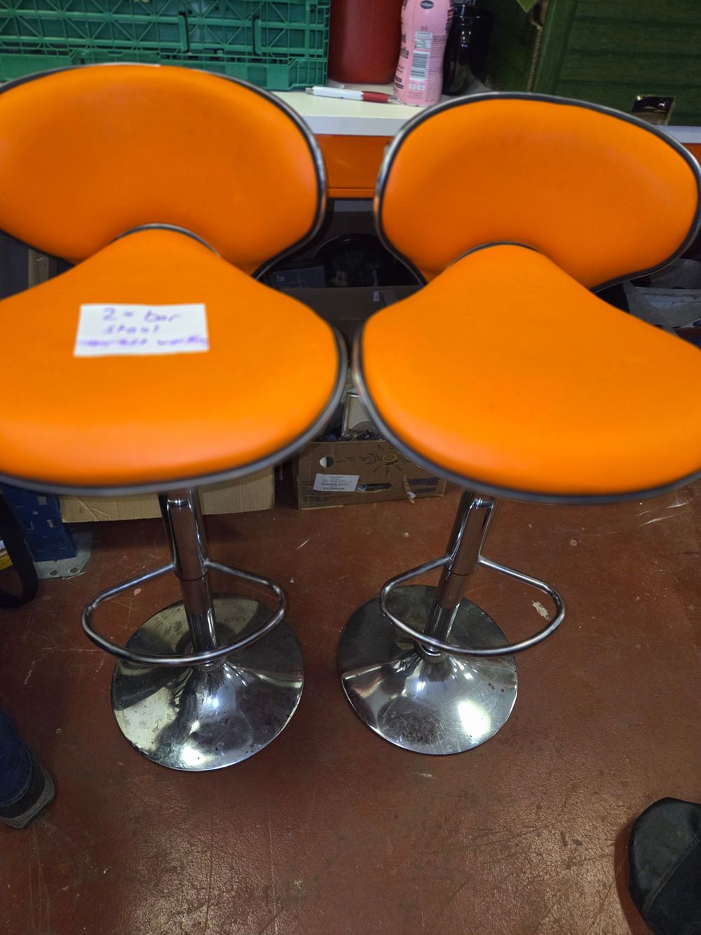 Lot 343 – A Pair of Contemporary Orange Vinyl Butterfly Back Bar Stools