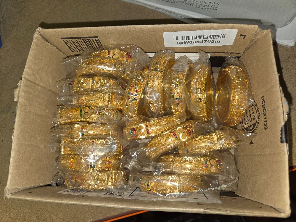 Lot 366 – A Collection of Gold-Plated Indian Style Filigree Bangles with Multi-Coloured Accents
