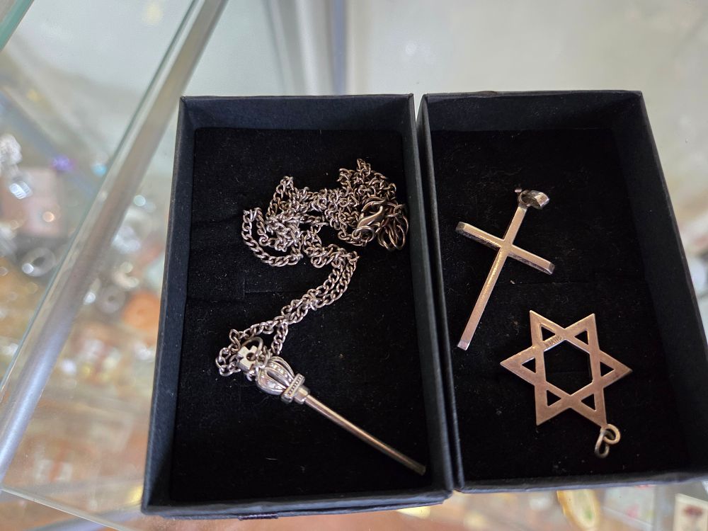 Lot 658 – A Trio of Silver 9.25 Religious and Novelty Pendants 11.02g