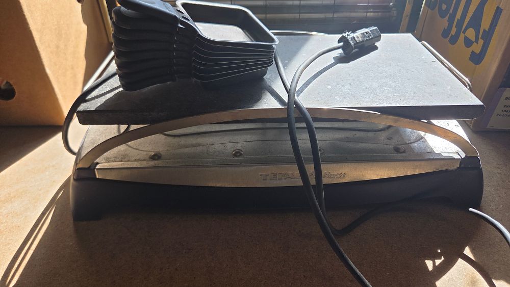 Lot 200 – A Tefal Ambiance Electric Stone Raclette Grill and a Set of Non-Stick Pans working order