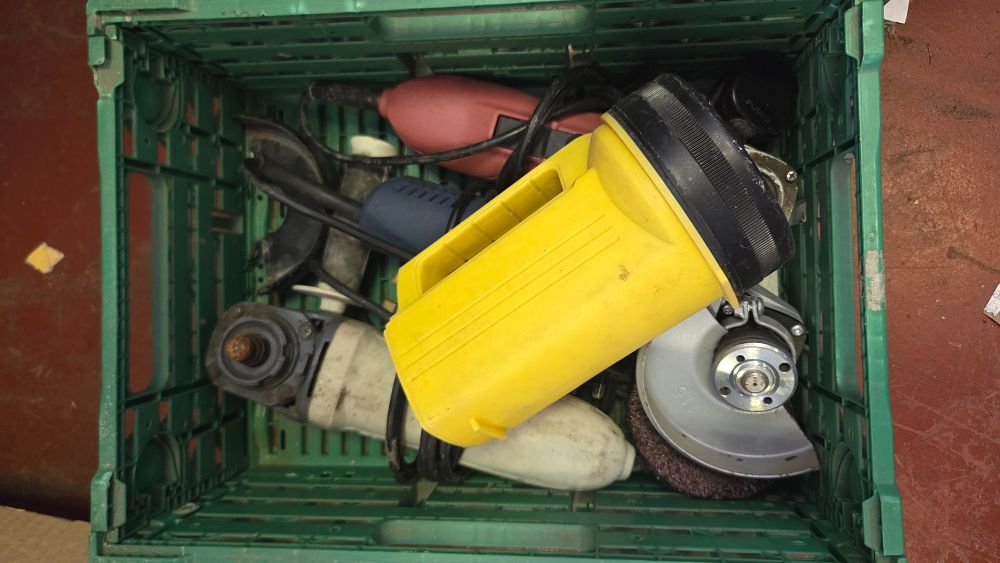 Lot 222 – An Assortment of Corded Angle Grinders and a Handheld Lantern