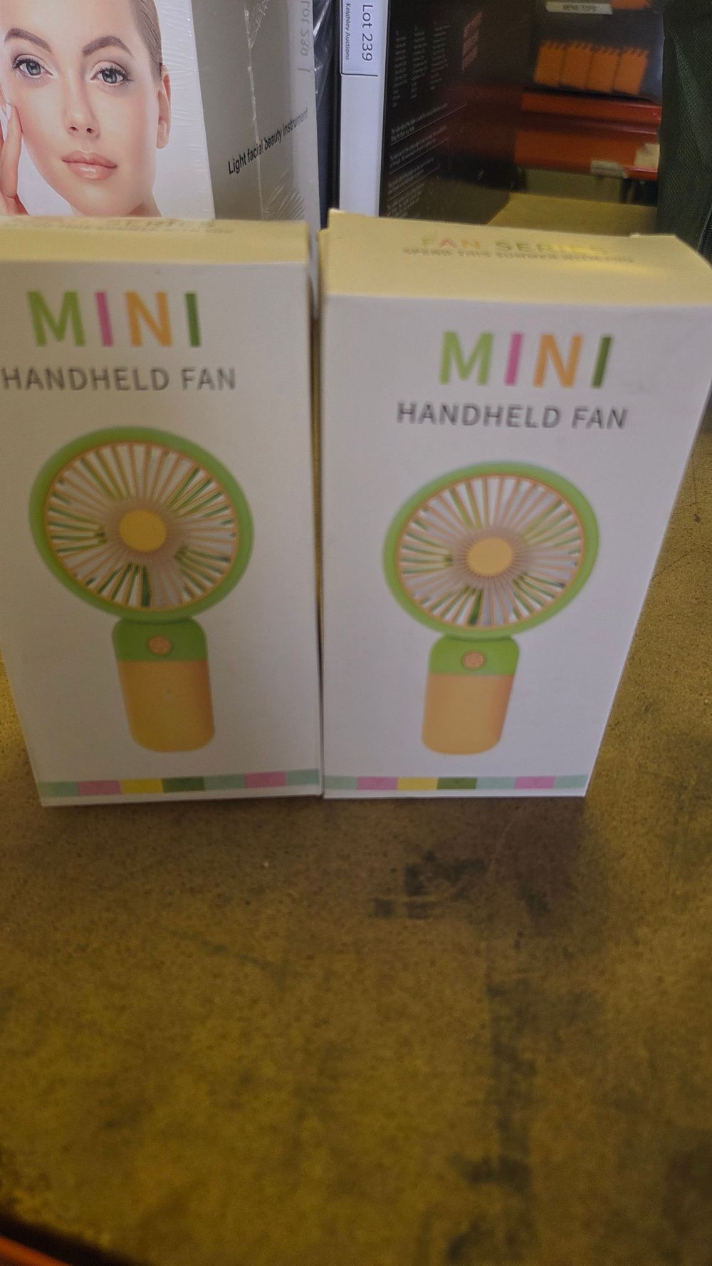 Lot 242 – A Pair of Mini Handheld Fans