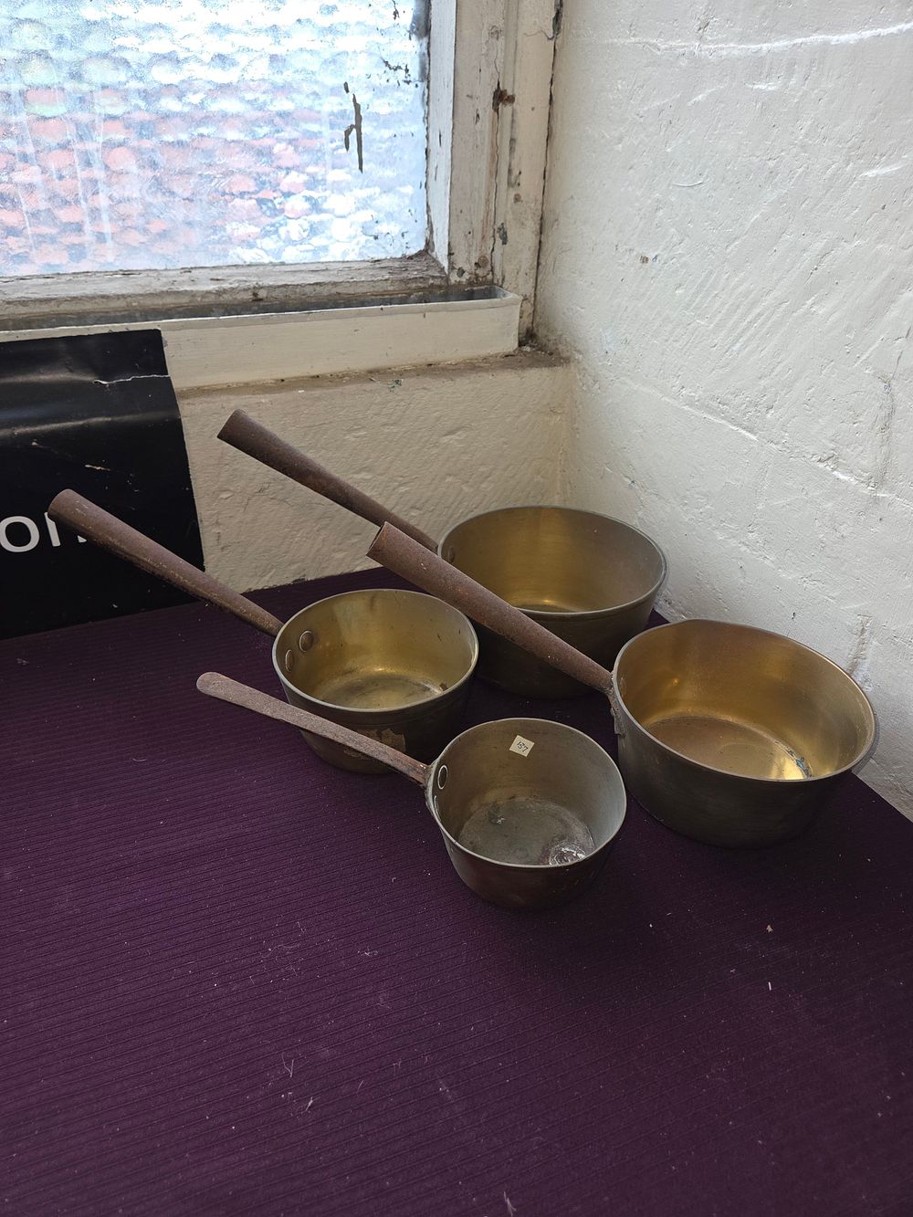 Lot 160 – A Set of Four Antique Victorian Graduated Brass Saucepans with Iron Handles