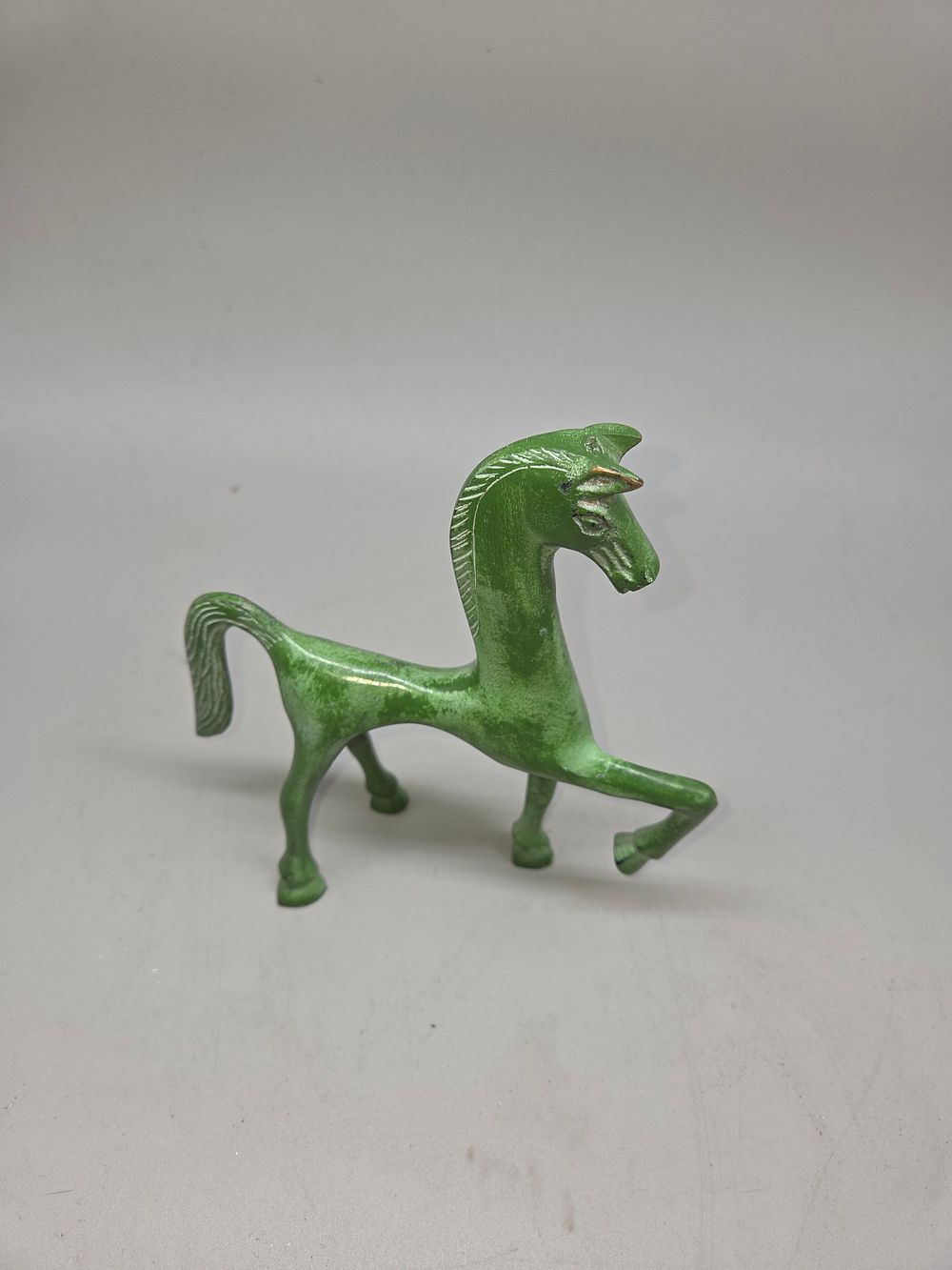 Lot 171 – A Brass horse figurine in the Greek Geometric style with verdigris finish