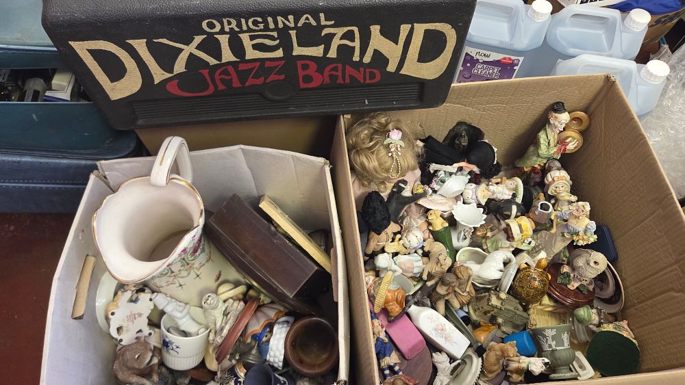 Lot 303 – Two Boxes of Decorative Porcelain Figurines, Collectables, and a Dixieland Jazz Band Instrument Case