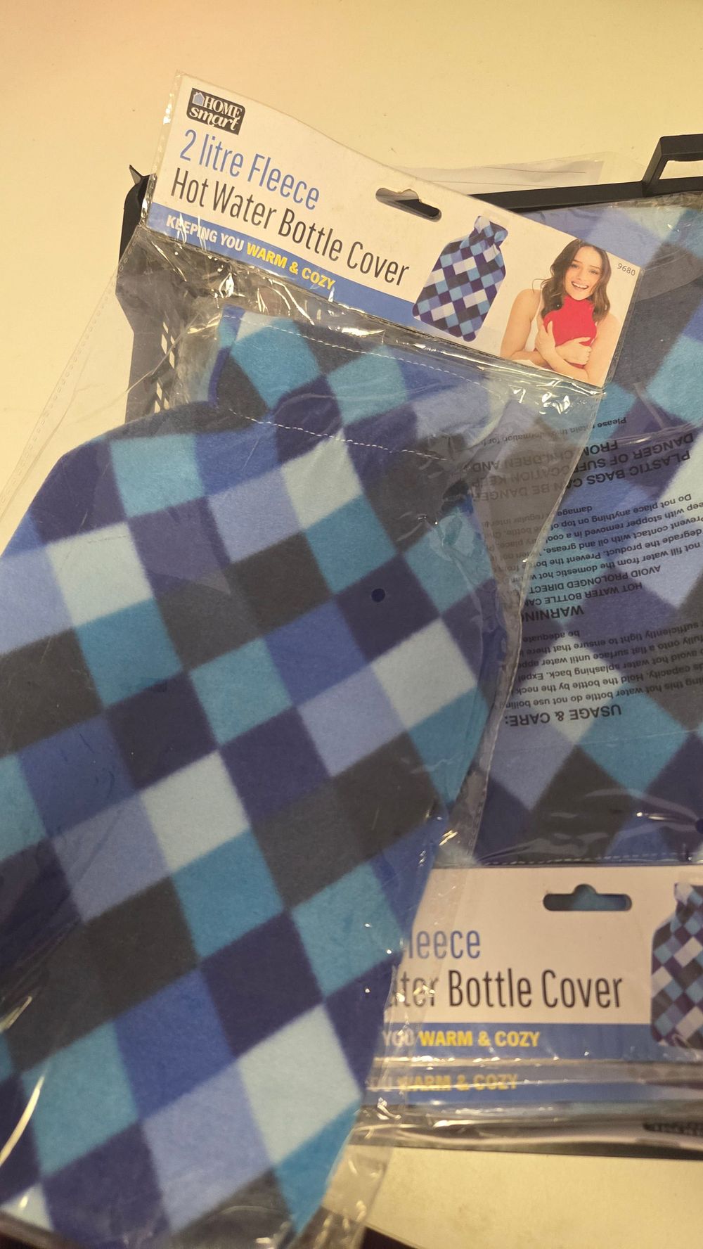 Lot 325 – A Selection of Home Smart 2-litre Fleece Hot Water Bottle Covers in Blue Chequered Pattern