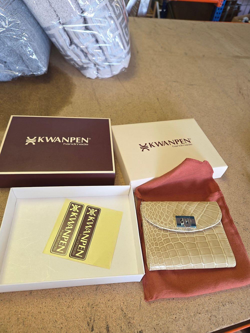 Lot 357 – A Kwanpen Handmade Cream Crocodile Leather Flap Wallet