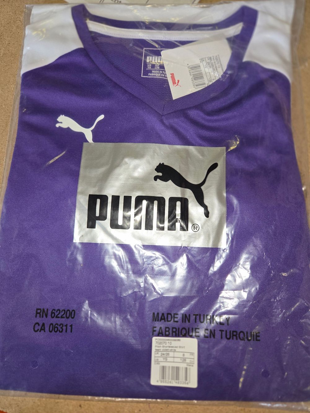 Lot 389 – Puma Pitch Short Sleeve Youth Football Jersey in Purple and White aged 8-9