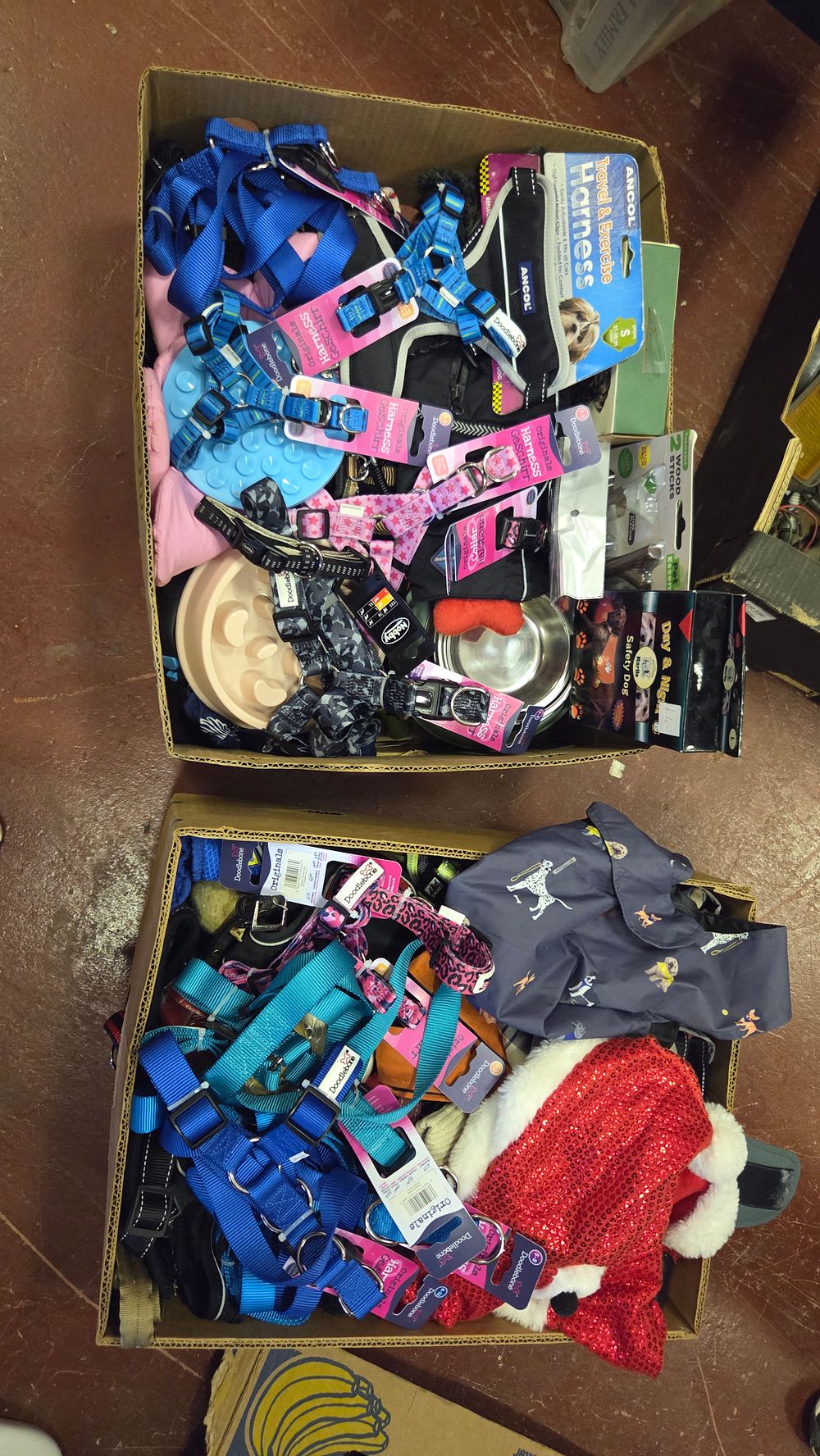 Lot 347 – Two Boxes of Branded Pet Accessories Including Doodlebone and Ancol Harnesses and Collars. Some New
