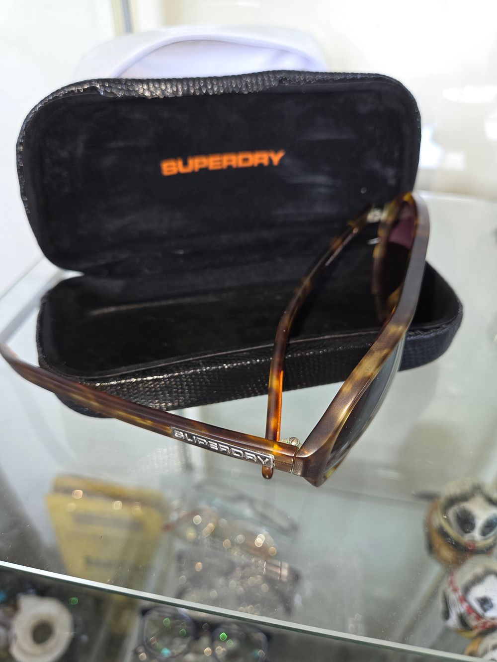 Lot 603 – A pair of Superdry tortoiseshell-patterned sunglasses and case