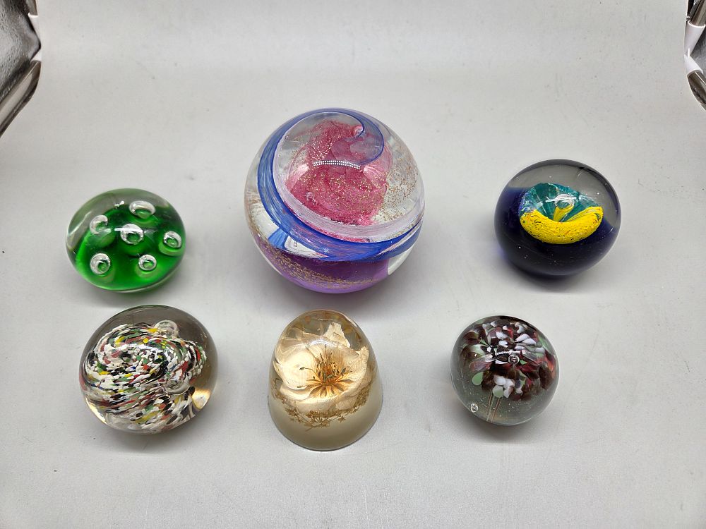Lot 190 – A Collection of Six Assorted Studio Glass Paperweights including Bullicante, Millefiori, and Swirl Designs
