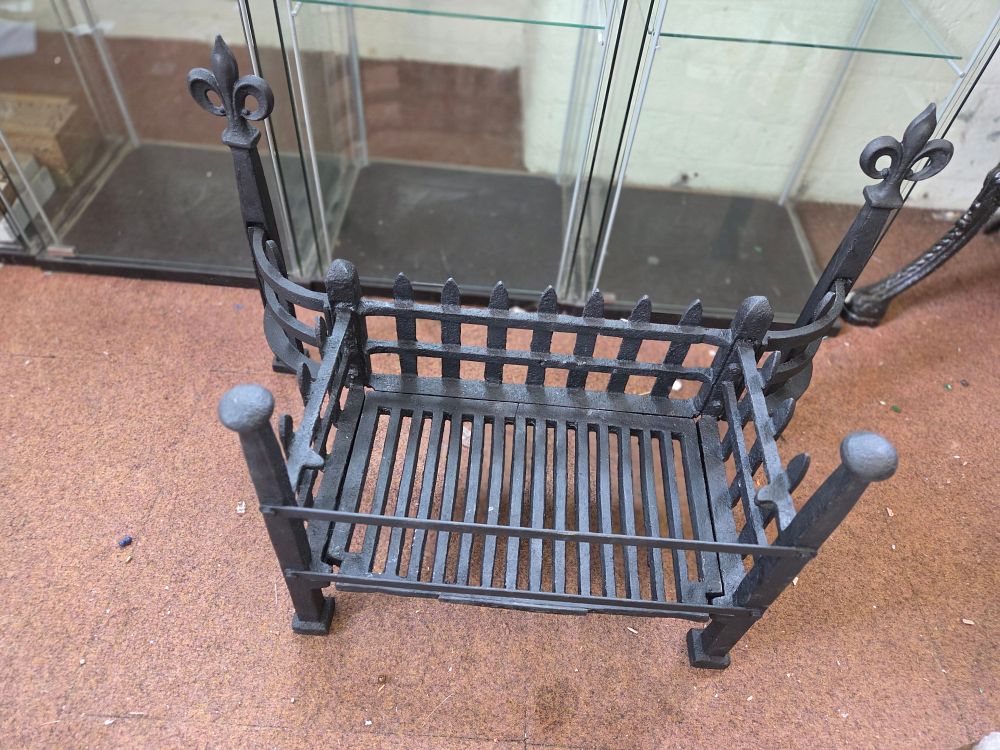 Lot 207 – An English Gothic Revival style cast iron fire basket