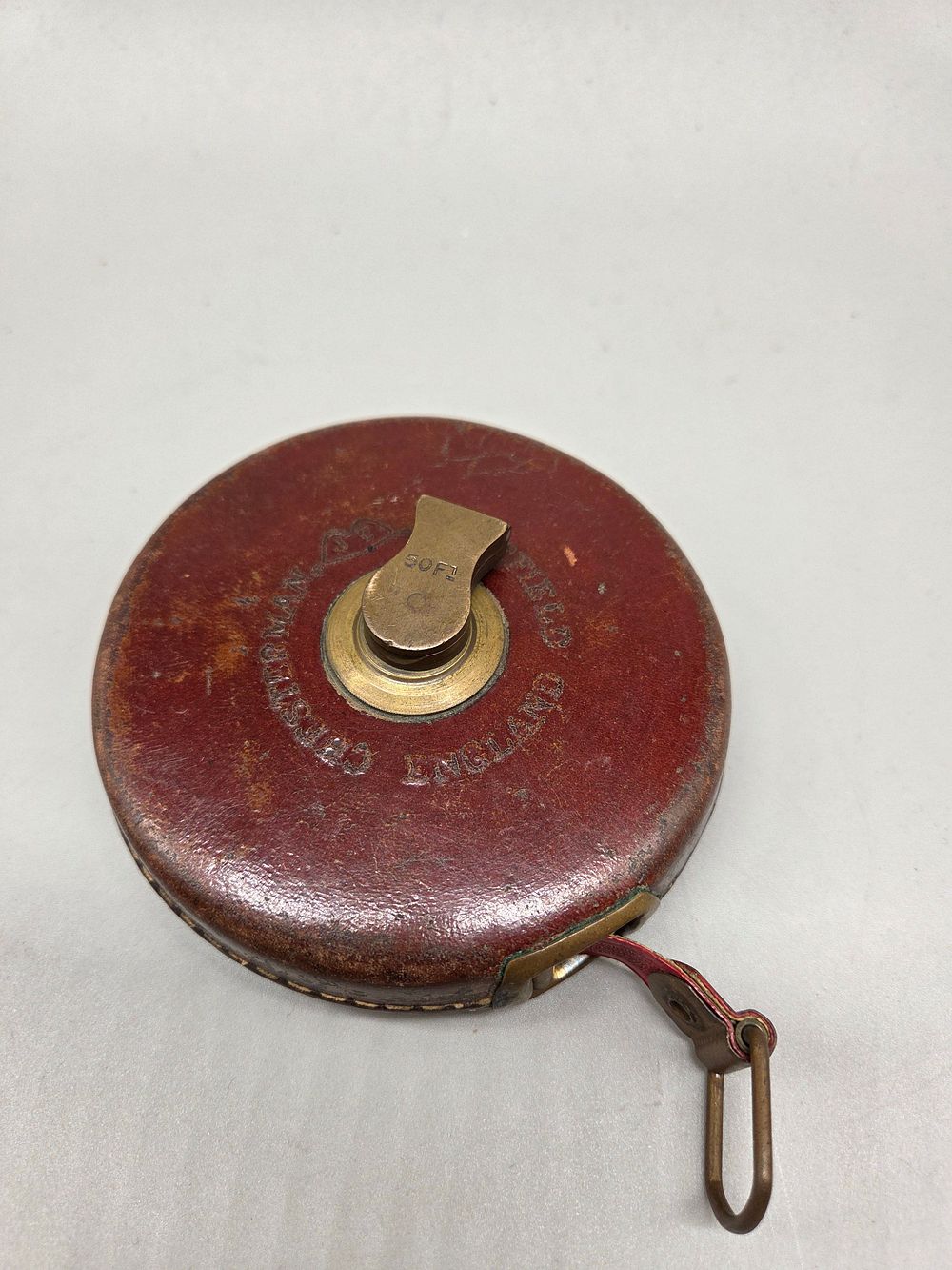 Lot 208 – An antique James Chesterman and Co 50 foot metallic tape measure in leather case