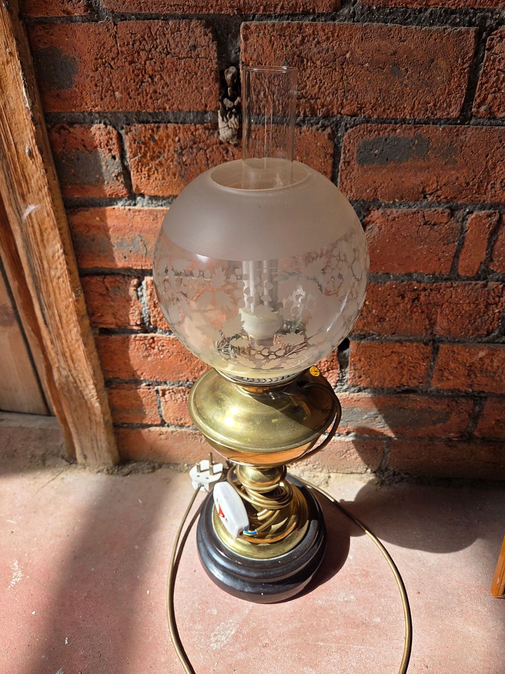 Lot 217 – A Victorian Style Polished Brass and Wood Electric Table Lamp with Etched Glass Globe