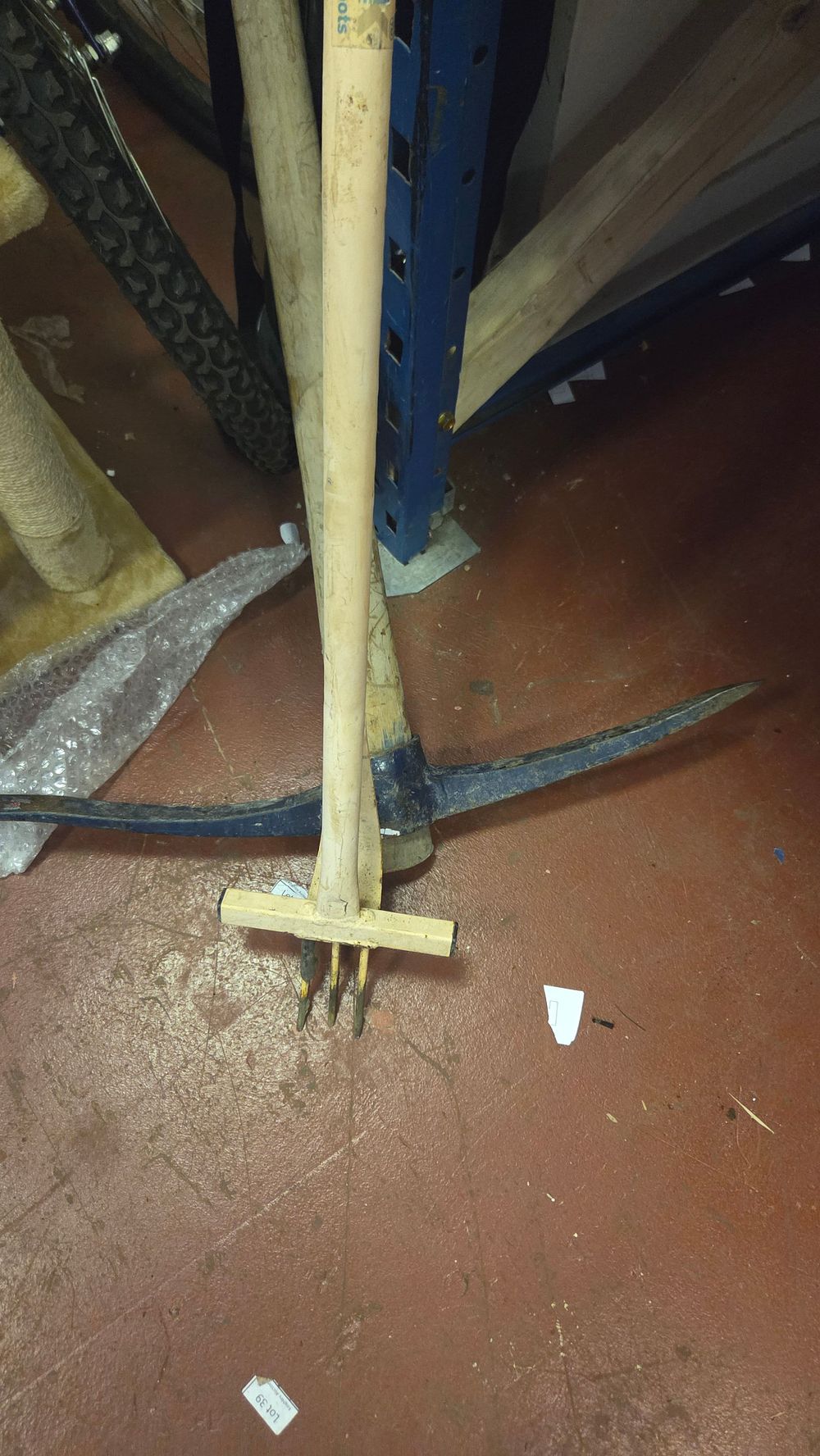 Lot 234 – Two Long-Handled Tools Including a Pickaxe and a T-Head Cultivator