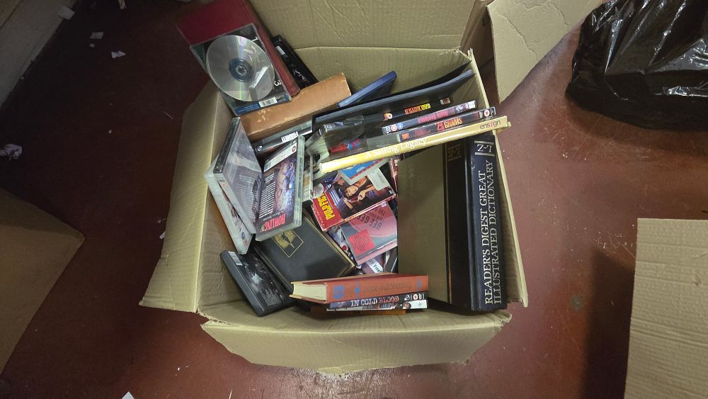 Lot 238 – An Assortment of Books and DVDs including Readers Digest Dictionary and Film Titles