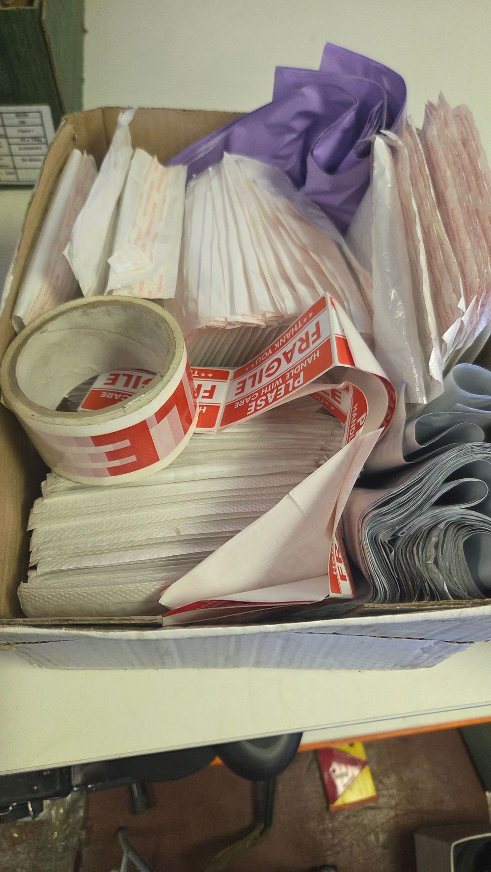 Lot 301 – An Assortment of Shipping and Mailing Supplies Including Padded Envelopes and Fragile Tape
