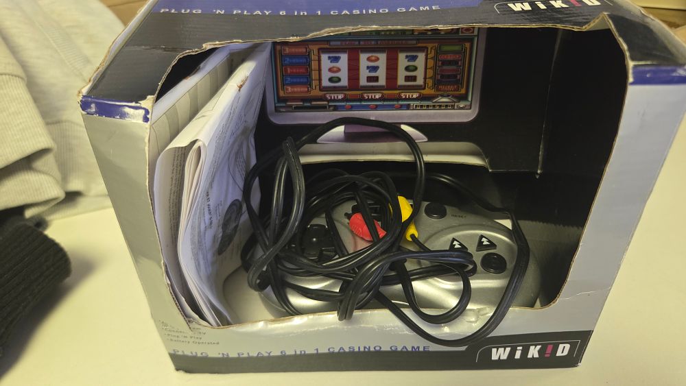 Lot 327 – WiKiD Plug ‘n Play 6-in-1 Casino Game System with Original Box