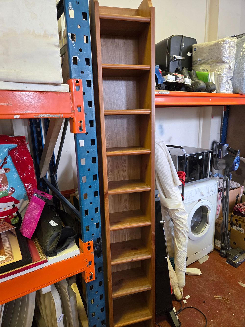 Lot 404 – A contemporary stained pine multimedia storage rack