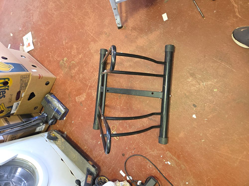 Lot 408 – A Double-Sided Black Powder-Coated Tubular Steel Bicycle Floor Rack