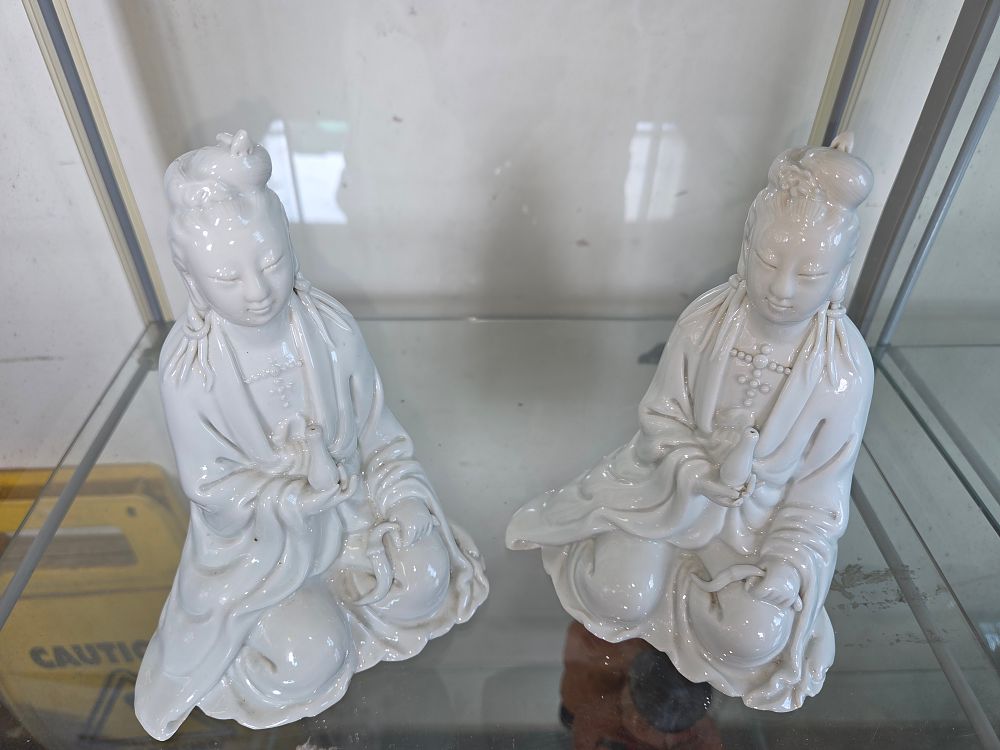 Lot 616 – A Pair of Chinese Blanc de Chine Porcelain Figures of Guanyin
