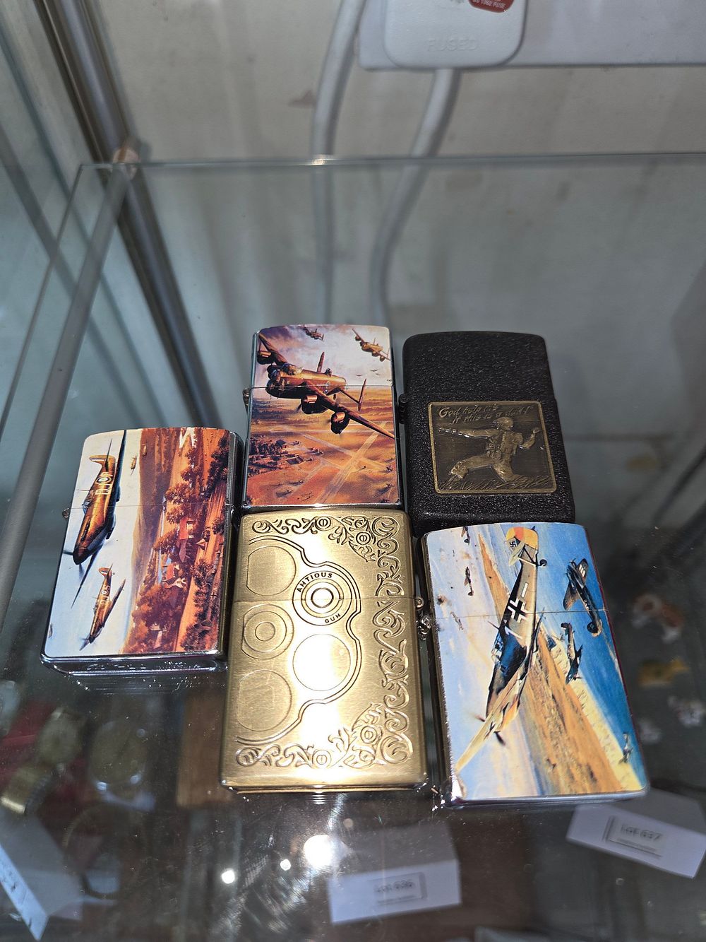 Lot 638 – A Collection of Five Modern Commemorative Flip-top Lighters with World War II Aviation and Military Themes