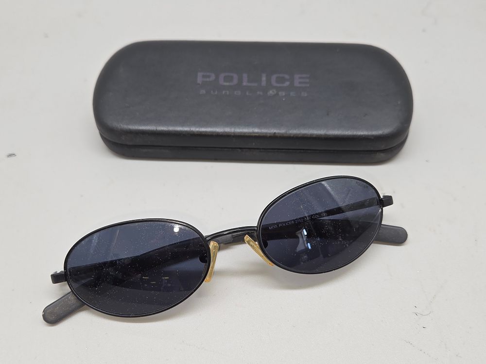 Lot 641 – A Pair of Vintage Police MOD 2752 Metal Oval Sunglasses with Case