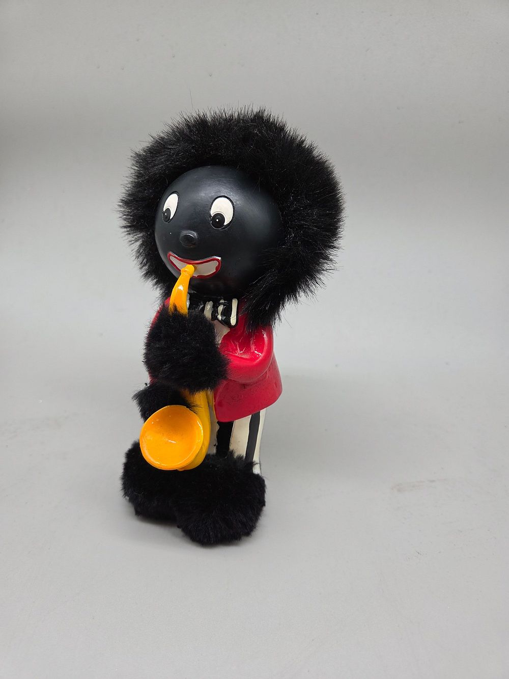 Lot 255 – A Vintage Golly Musician Money Bank Attributed to Robertson’s Jam