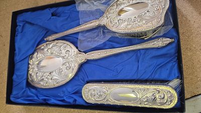 A Trio of Silver-Plated Ornate Repouss&eacute; Dressing Table Items in a Fitted Case