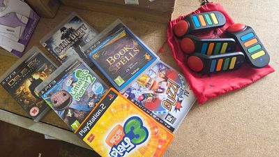 A Collection of Sony PlayStation Video Games and Official Buzz! Wireless Controllers
