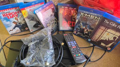 A Panasonic Blu-ray Player with Remote and a Collection of Blu-ray Discs