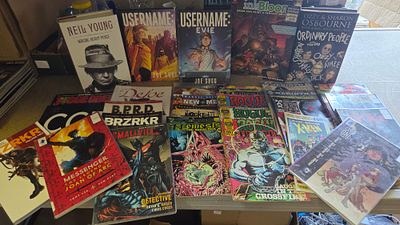 A Collection of Books, Graphic Novels, and Comic Books Including Biographies and Ex-Library Volumes
