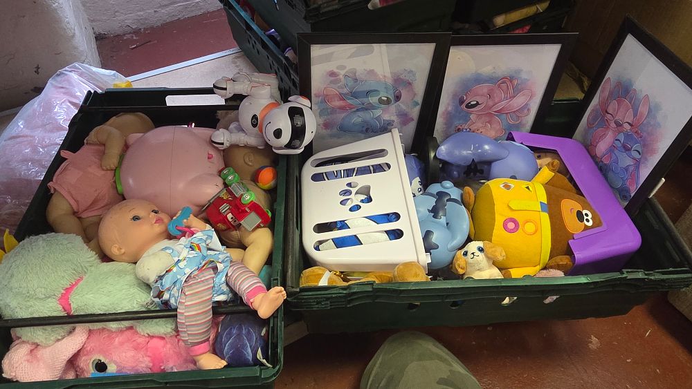 Lot 209 – Two Boxes of Children’s Toys, Plush Figures, and Disney Themed Prints