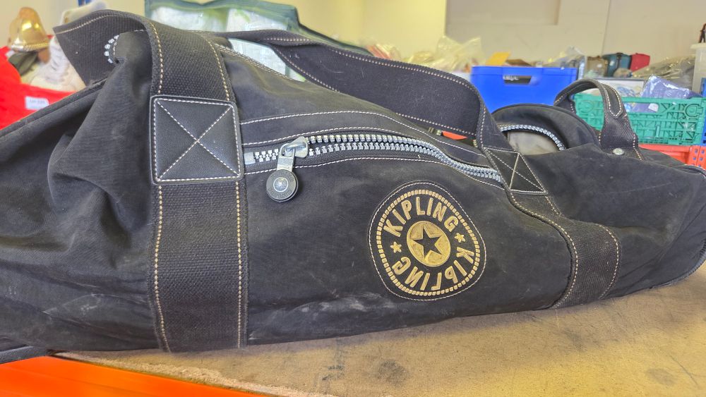 Lot 230 – A Kipling black washed canvas travel duffle bag