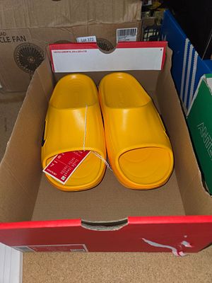 A Pair of Nike Calm Slide Sandals in Laser Orange Size 5.5