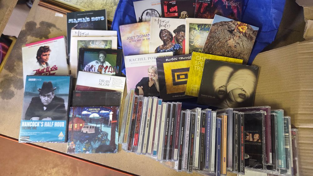 Lot 286 – A Collection of New CDs and DVDs Featuring Various Musical Artists and British Comedy